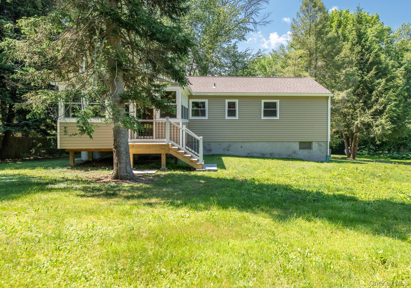 676-678 Oak Summit Road Millbrook, NY 12545 - Photo 26 of 38 Grill deck with stairs to yard