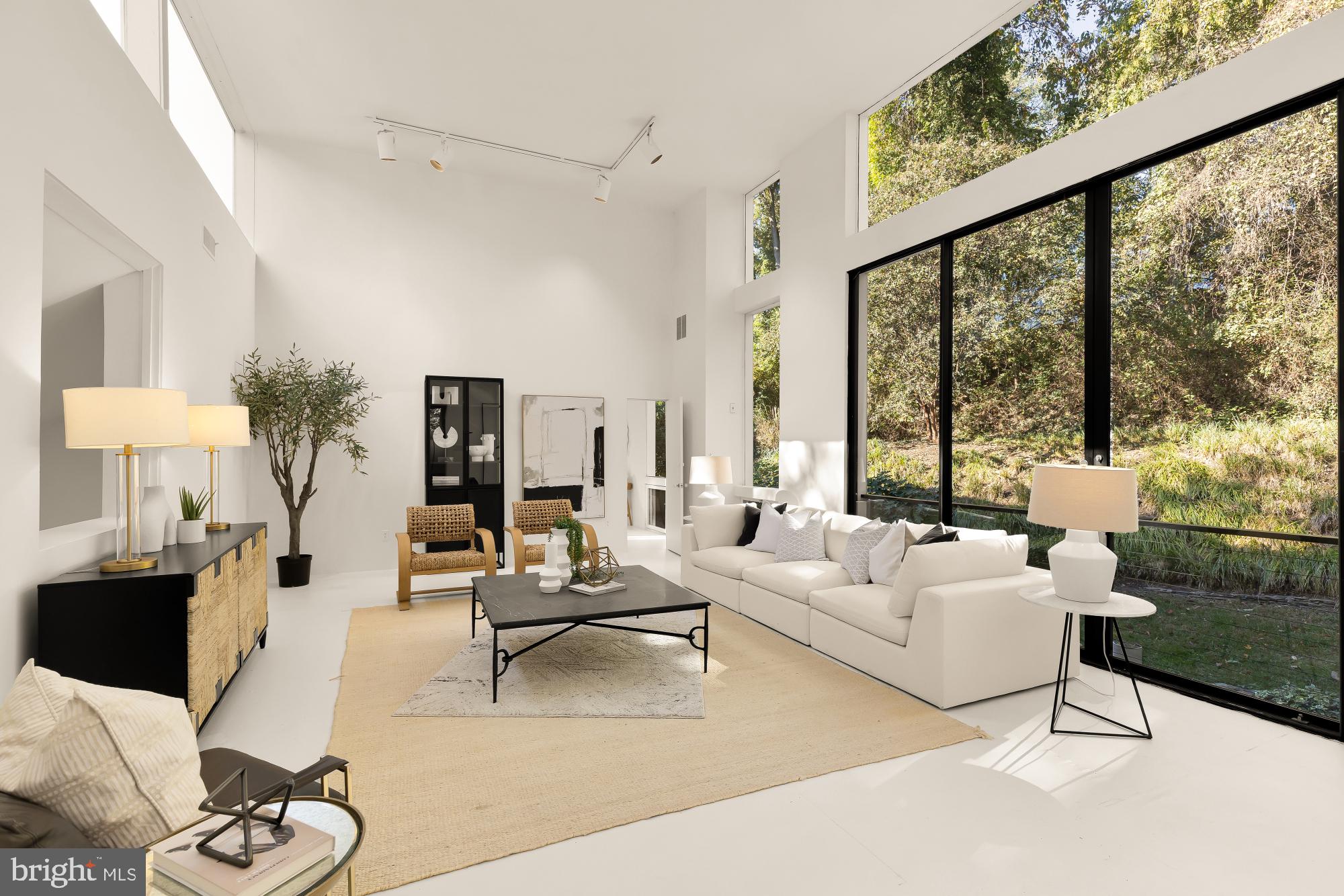 3524 Williamsburg Lane Northwest Washington, DC 20008 - Photo 1 of 49 a living room with furniture and a large window