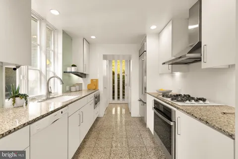 a bedroom with a bed and a chair