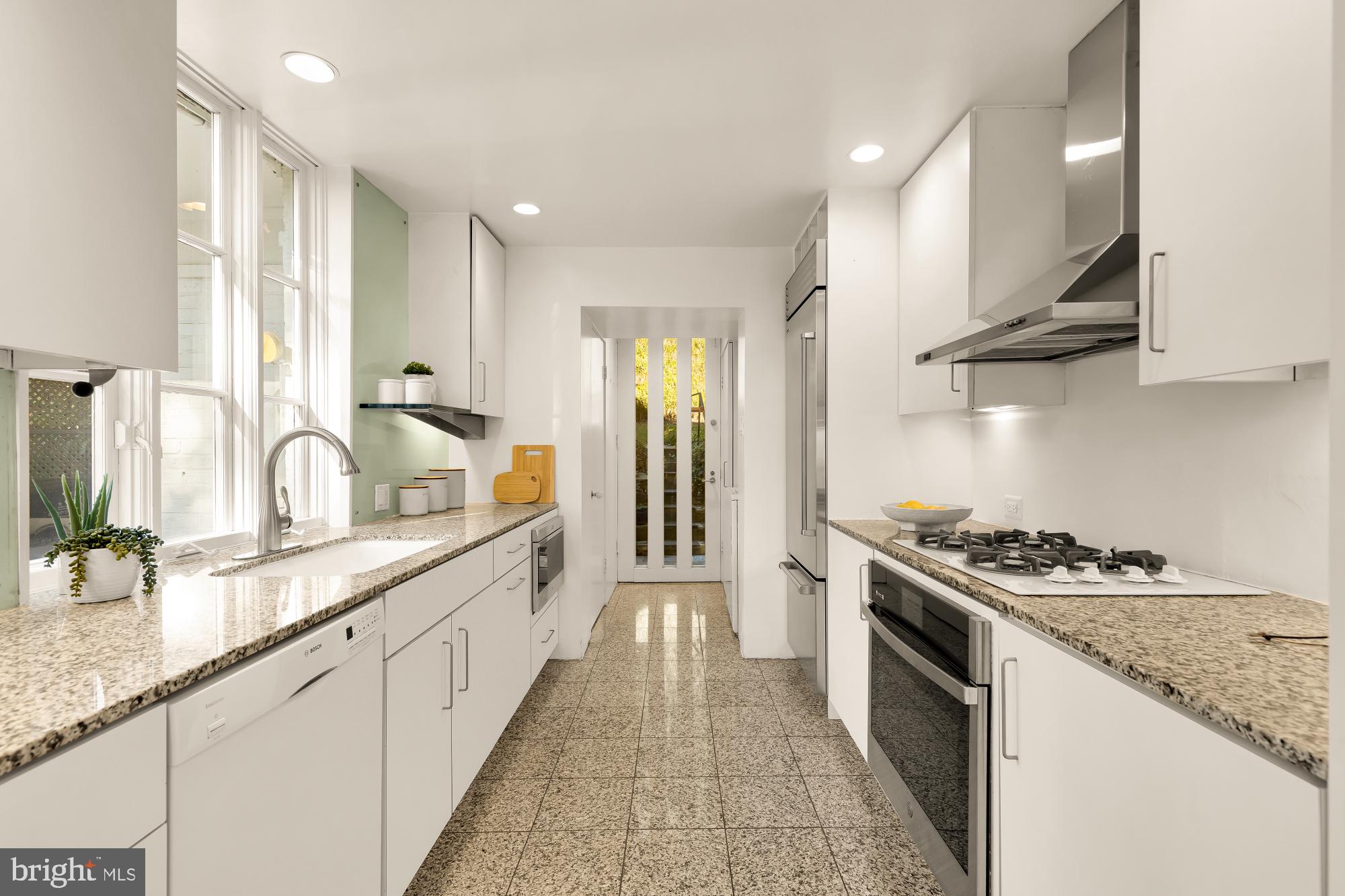 3524 Williamsburg Lane Northwest Washington, DC 20008 - Photo 19 of 49 a kitchen with stainless steel appliances granite countertop a sink stove and cabinets
