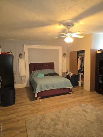 a bedroom with a bed and cabinets