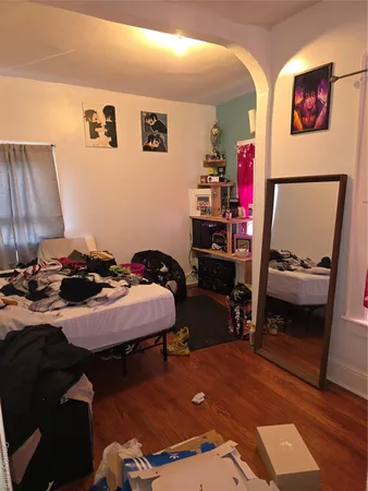 a bedroom with a bed and a dresser