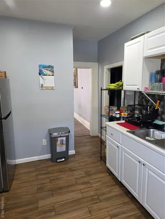 a room with wooden floor and furniture