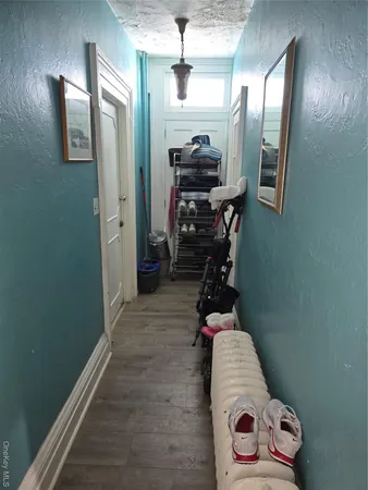 a room with lots of stuff and hardwood floor