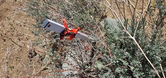 an aerial view of a house with a yard and sitting area