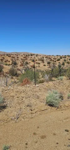 a view of wooden fence of a road
