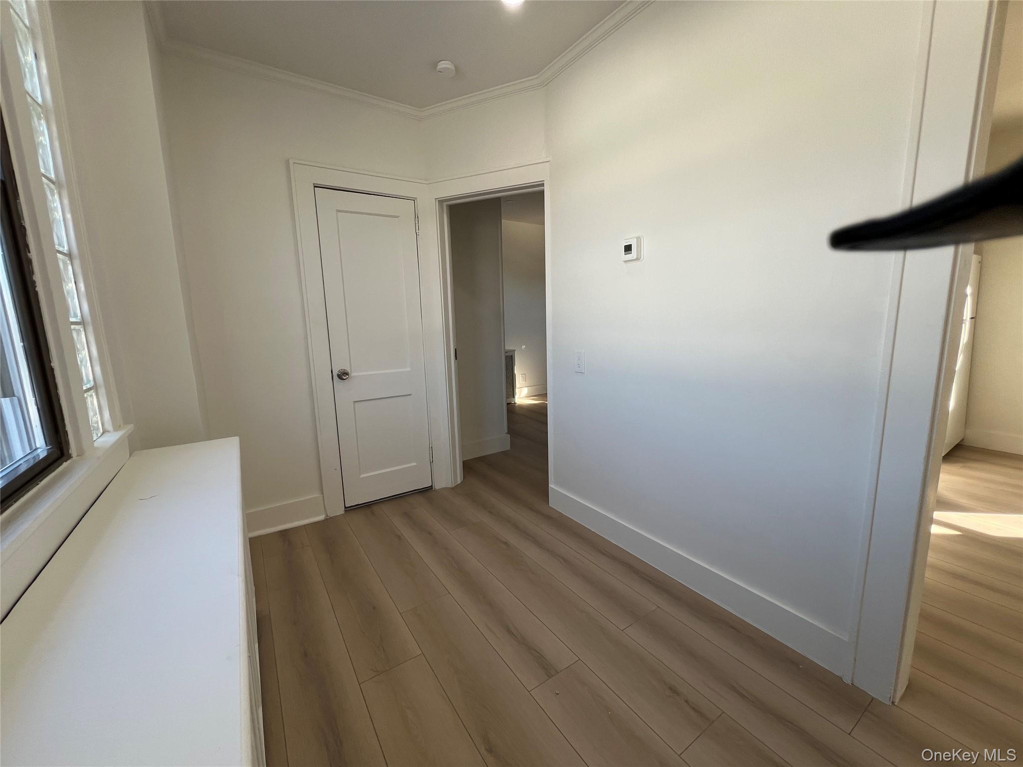 28 Walt Whitman Road Huntington Station, NY 11746 - Photo 16 of 17 a view of hallway with wooden floor