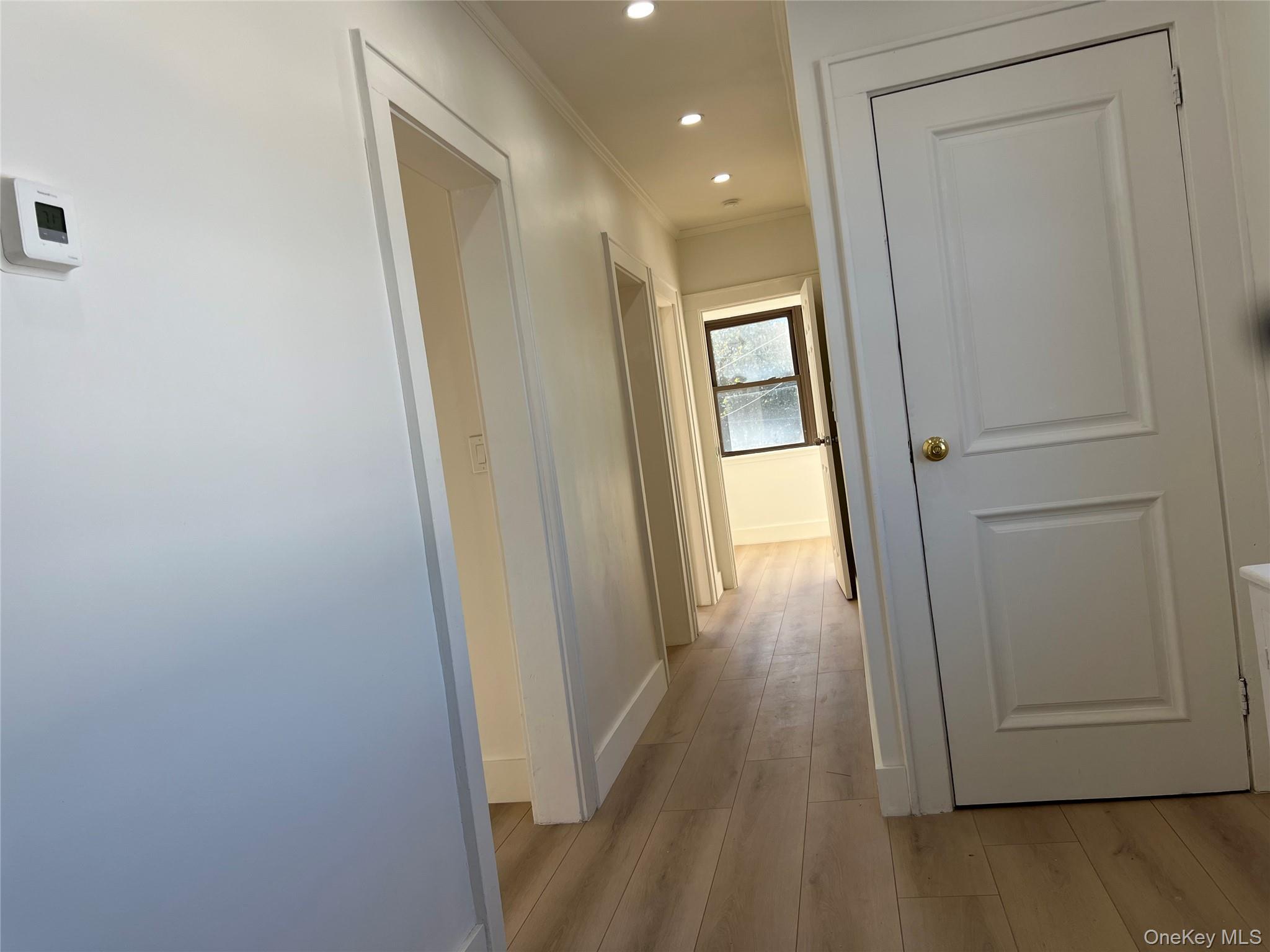 28 Walt Whitman Road Huntington Station, NY 11746 - Photo 8 of 17 a view of a hallway with wooden floor
