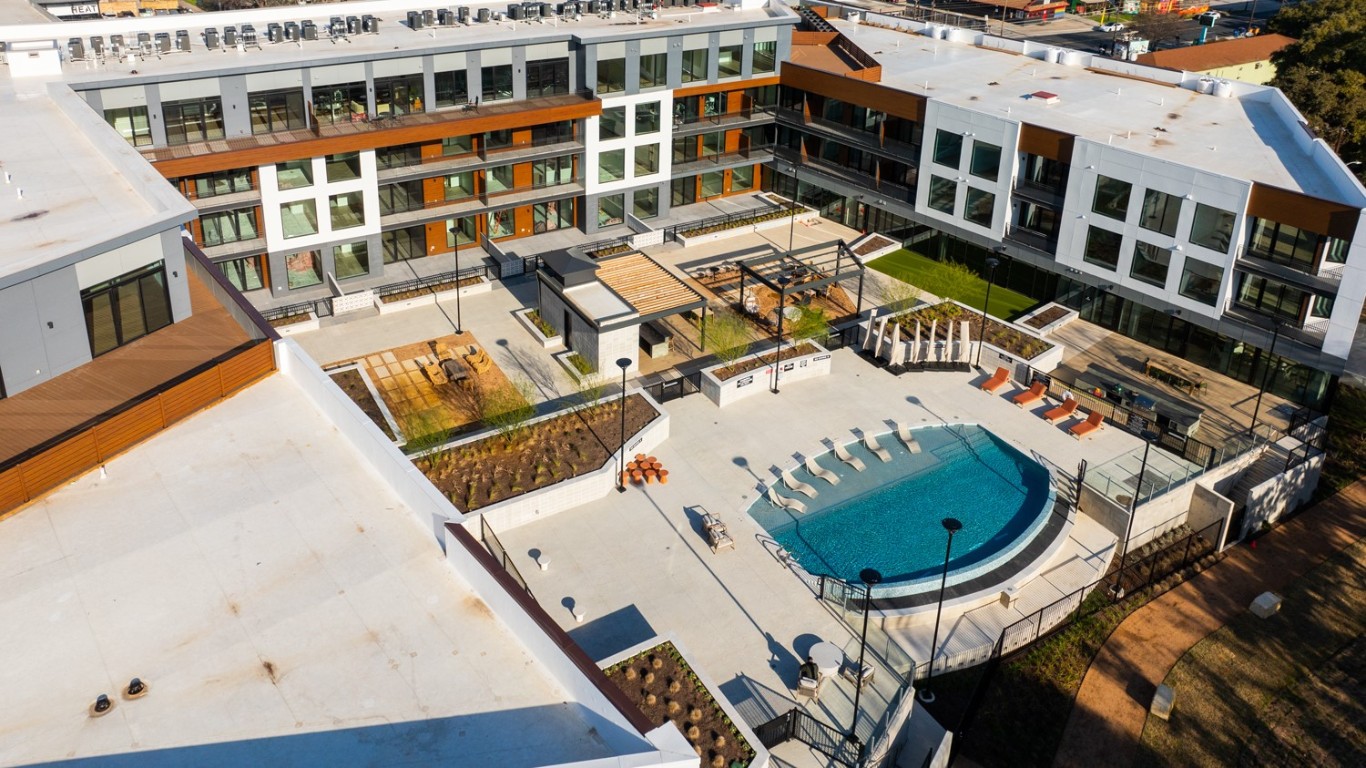 2209 South 1st Street, Unit 407 Austin, TX 78704 - Photo 27 of 30 a view of a balcony with wooden floor and outdoor space