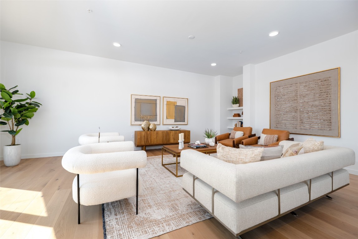 2209 South 1st Street, Unit 407 Austin, TX 78704 - Photo 8 of 30 a living room with furniture and a potted plant
