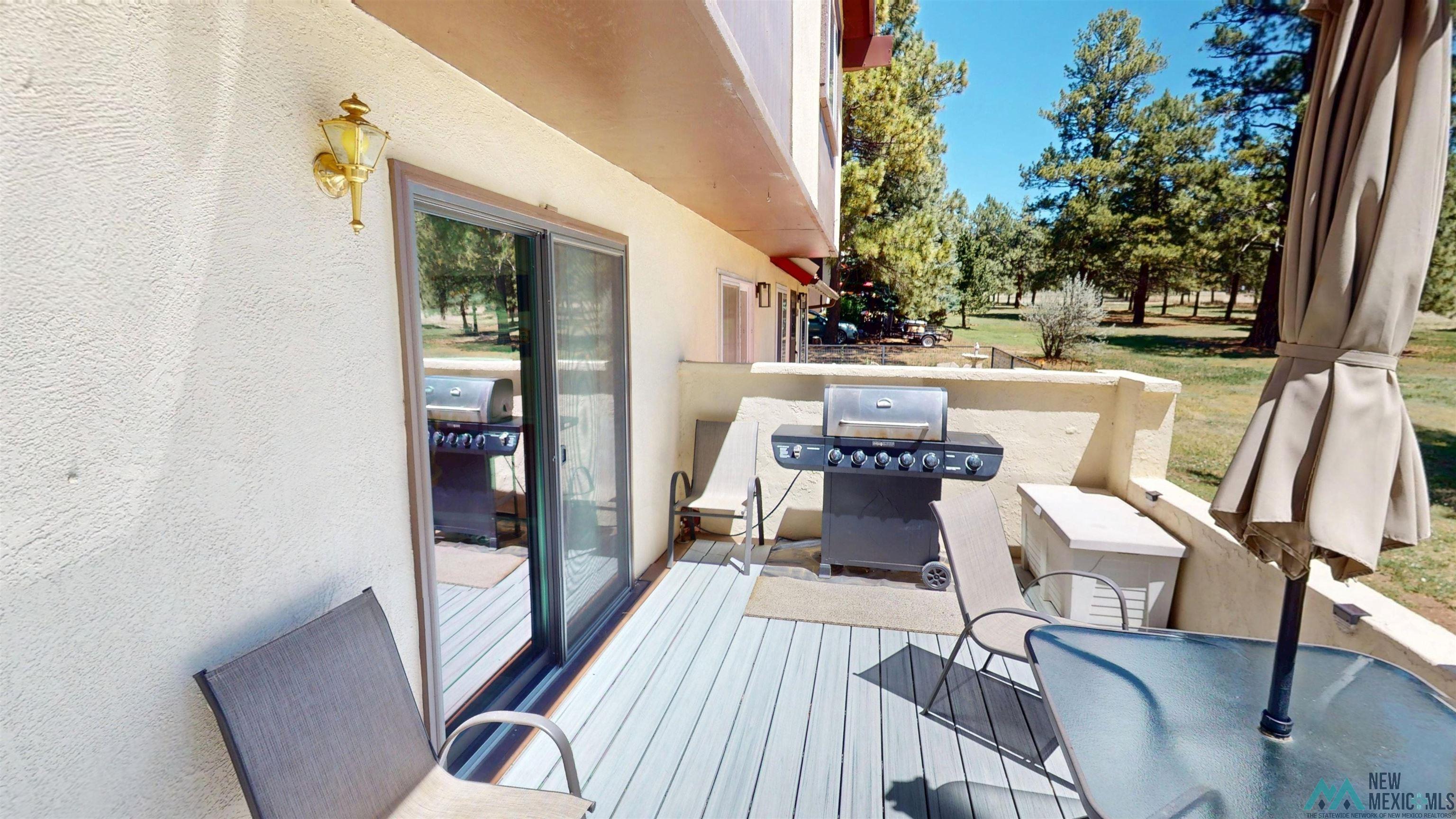 23 Pendaries Lane Rociada, NM 87742 - Photo 20 of 26 Outdoor deck with light gray composite decking