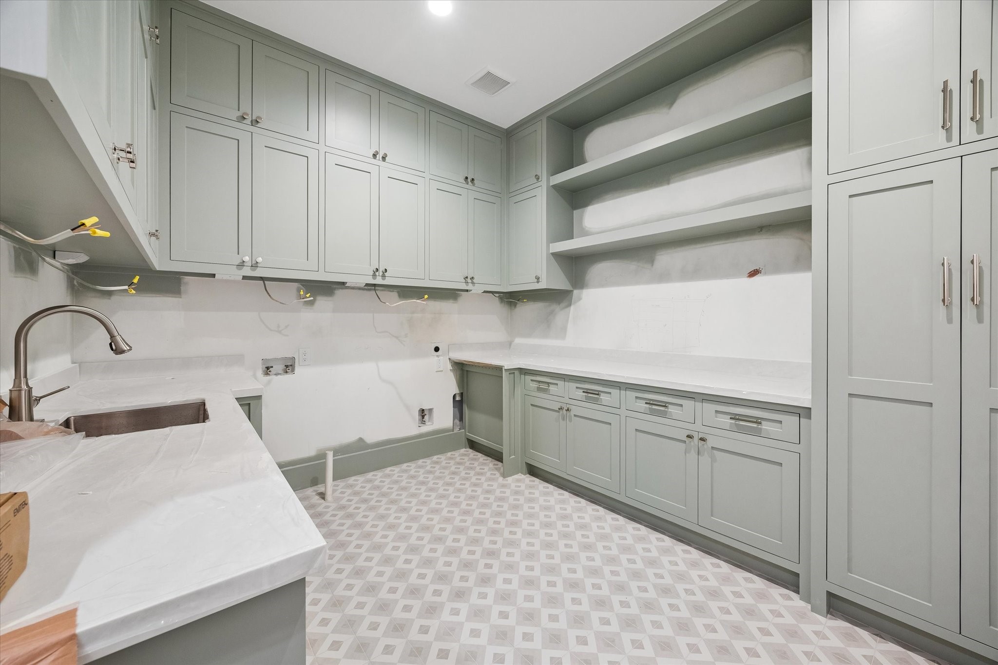 1328 Mickey Way Spring Valley Village, TX 77055 - Photo 17 of 26 Large upstairs utility room with plenty of storage. Pictured April 2026.