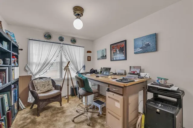 a view of a workspace with furniture