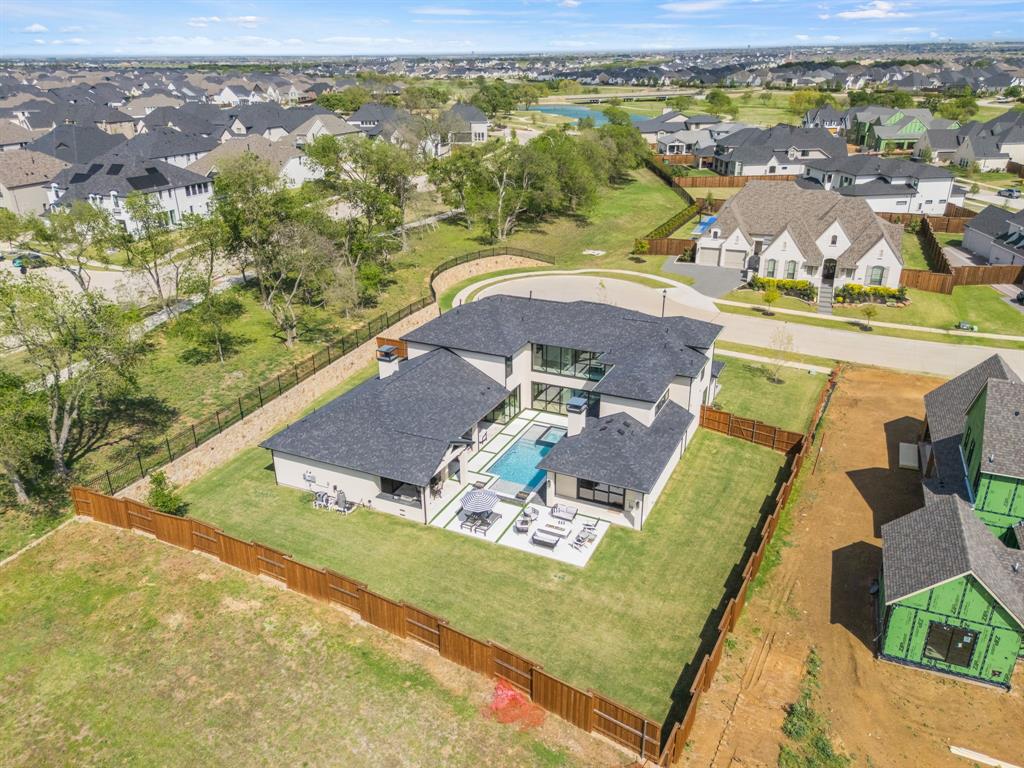 381 Spade Rnch Road Prosper, TX 75078 - Photo 5 of 40 .46 Acres- pool/spa, outdoor kitchen, and firepit are already in place with PLENTY of flat grassy space to add a sports court, putting green, and really whatever you can dream up!