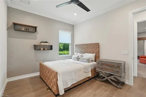 a bedroom with a bed and a table