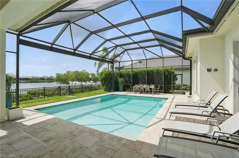 a view of a swimming pool with a patio