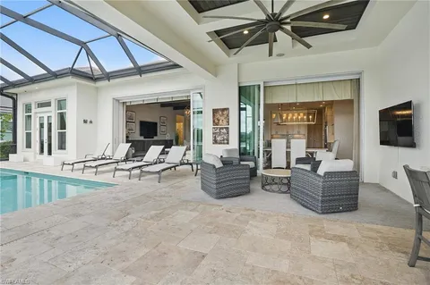 a white kitchen with a table and chairs in it