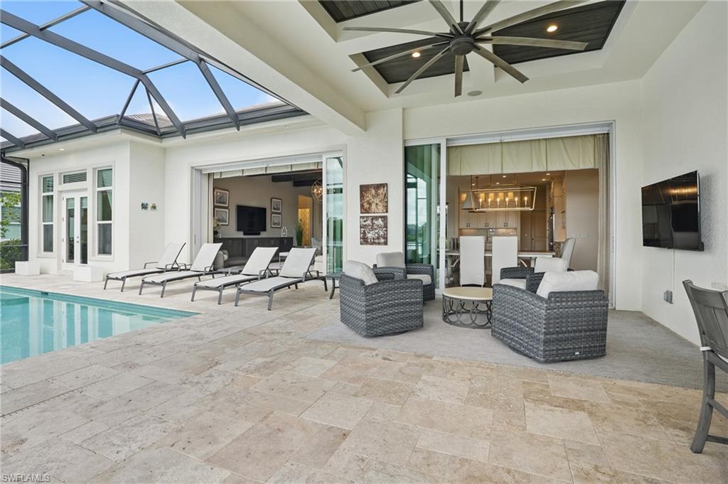 17218 Hidden Estates Circle Fort Myers, FL 33908 - Photo 39 of 50 a living room with furniture and a flat screen tv
