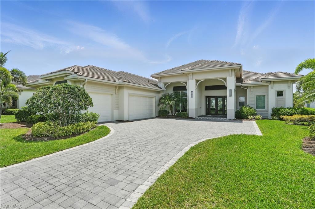 17218 Hidden Estates Circle Fort Myers, FL 33908 - Photo 4 of 50 a front view of a house with a yard