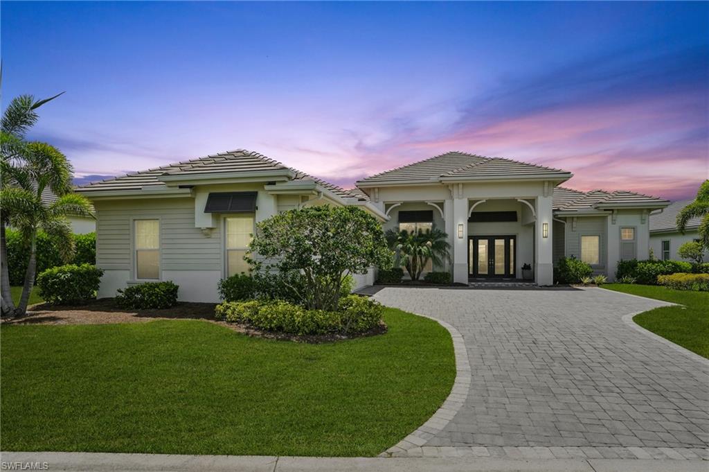 17218 Hidden Estates Circle Fort Myers, FL 33908 - Photo 46 of 50 a front view of a house with a yard