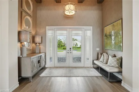 a spacious bathroom with a granite countertop bathtub next to a window