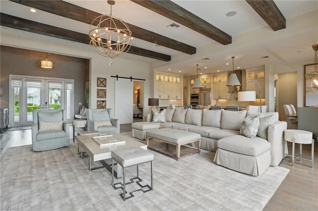 17218 Hidden Estates Circle Fort Myers, FL 33908 - Photo 6 of 50 a living room with lots of furniture and a chandelier