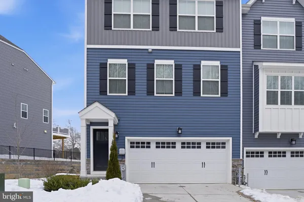 a front view of a building with a garden