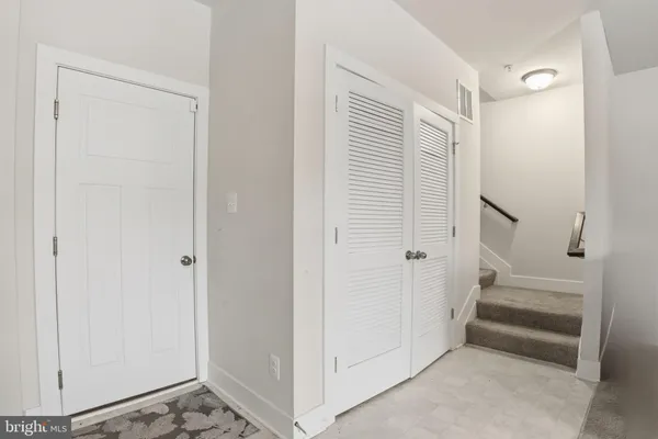 a view of entryway with stairs