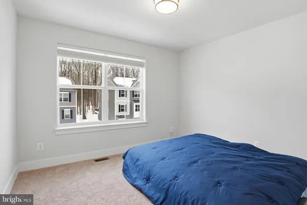 a view of a bedroom with a window