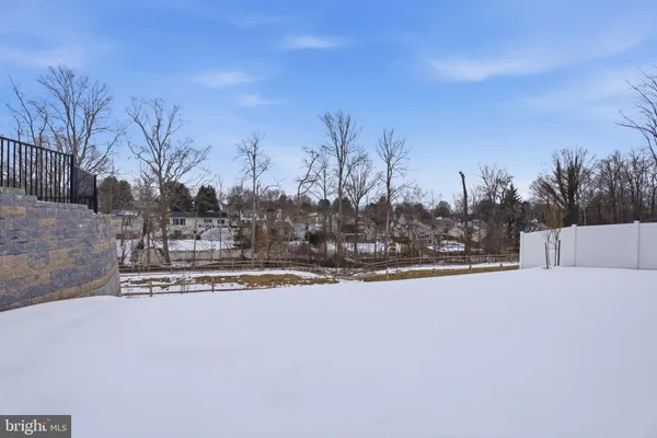 a view of swimming pool and trees in the background
