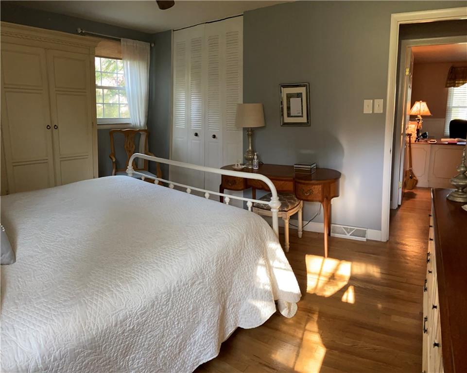 1421 Mayview Road Pittsburgh, PA 15241 - Photo 11 of 25 Special details include a ceiling paddle fan, hardwood floors and wall space for a variety of furniture pieces.