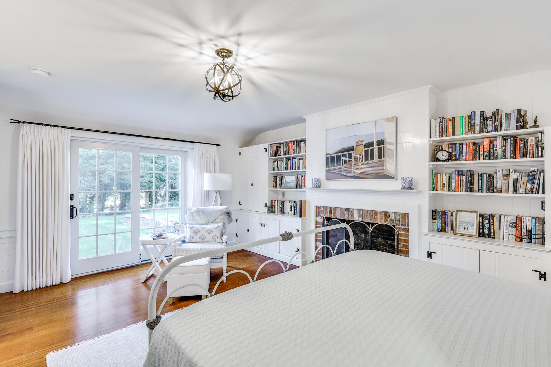 11 Seaview Road Orleans, MA 02653 - Photo 13 of 42 a bedroom with furniture and a fireplace