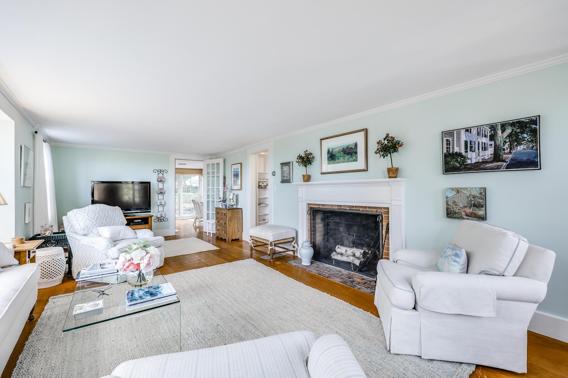 11 Seaview Road Orleans, MA 02653 - Photo 24 of 42 a living room with furniture and a fireplace