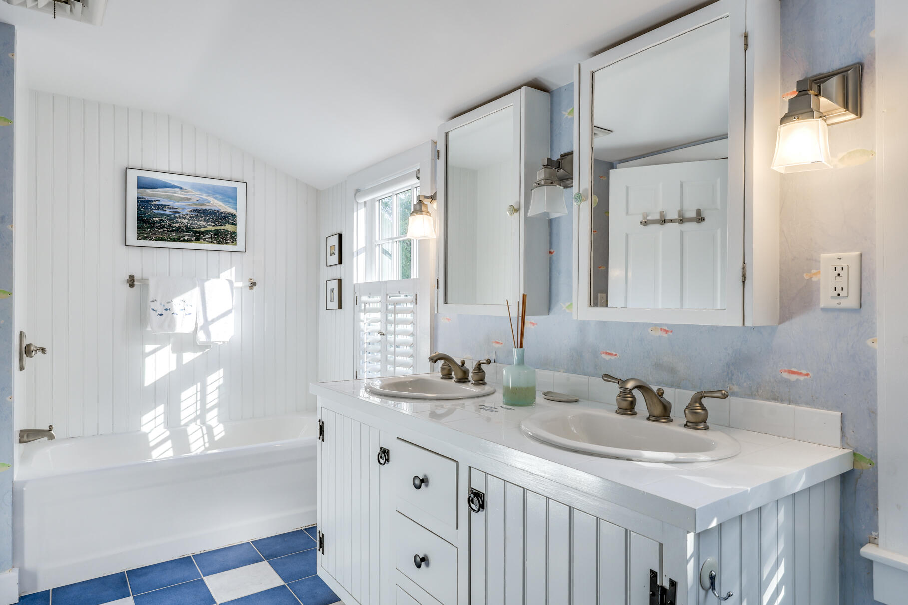 11 Seaview Road Orleans, MA 02653 - Photo 32 of 42 a bathroom with a sink double vanity granite tub and a mirror