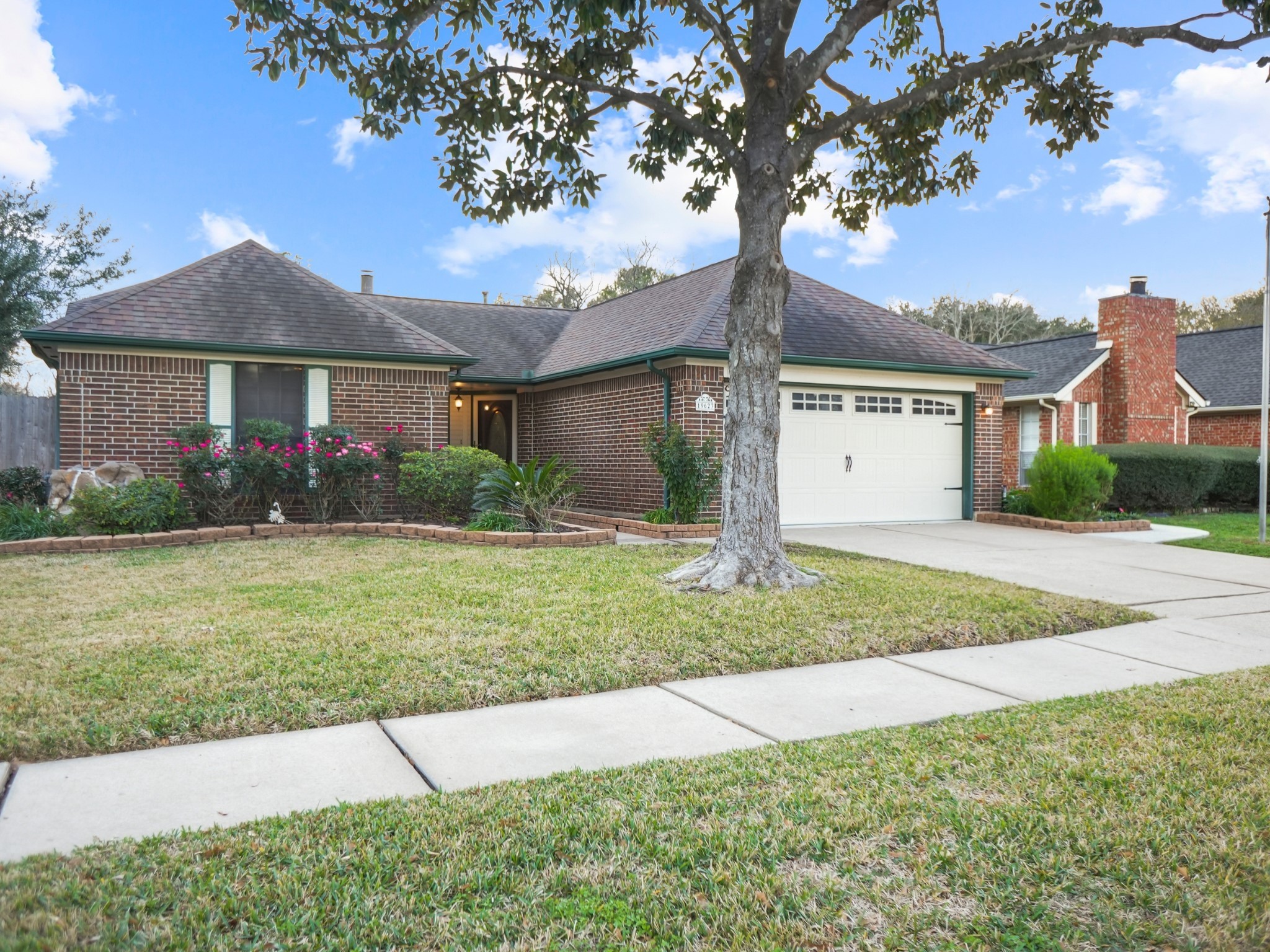 19623 Westbridge Lane Spring, TX 77379 - Photo 2 of 48 a front view of a house with garden