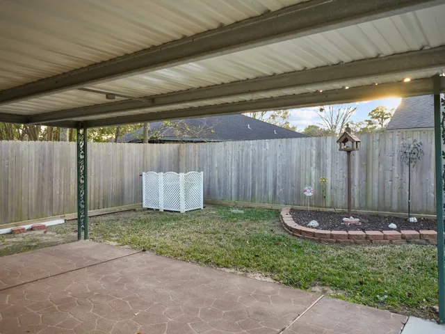 a kitchen with a sink appliances and cabinets