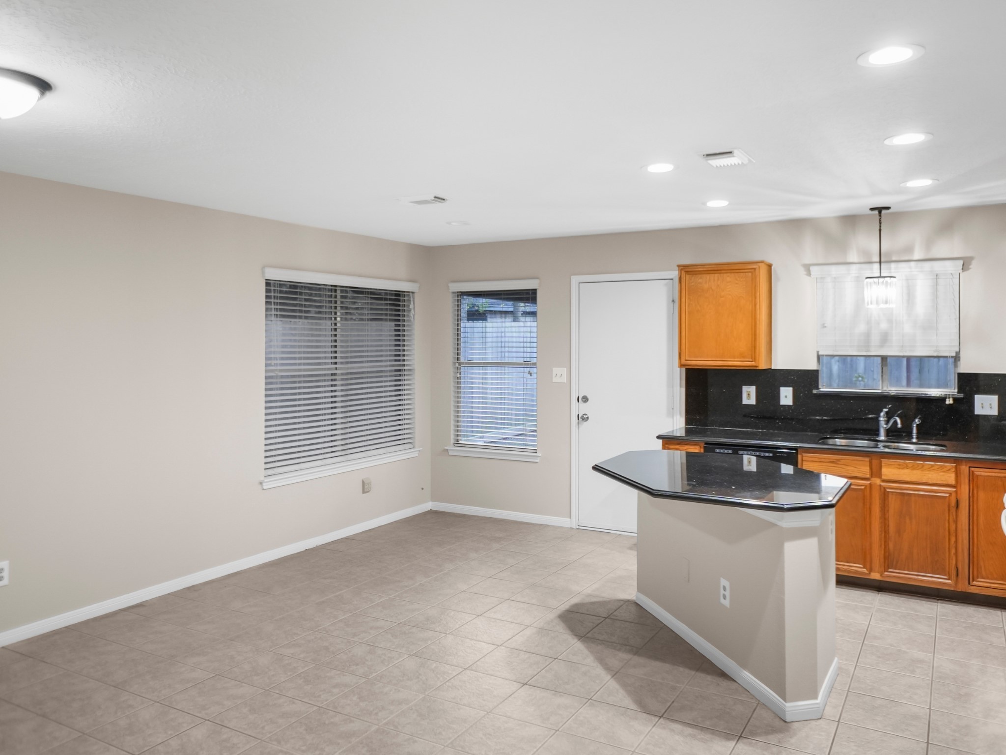 19623 Westbridge Lane Spring, TX 77379 - Photo 26 of 48 a kitchen with stainless steel appliances granite countertop a sink stove and cabinets