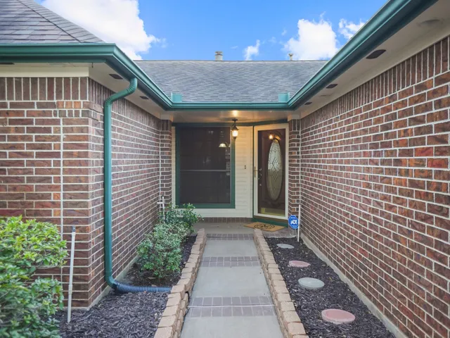 a front view of house with garden