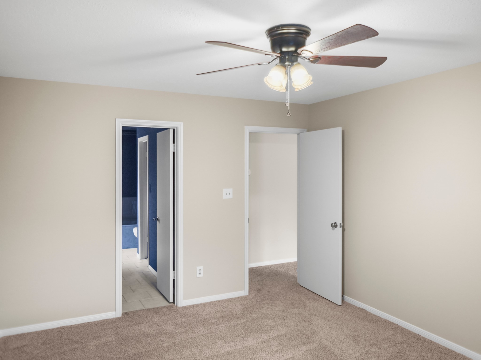 19623 Westbridge Lane Spring, TX 77379 - Photo 34 of 48 an empty room with a chandelier fan and a chandelier fan