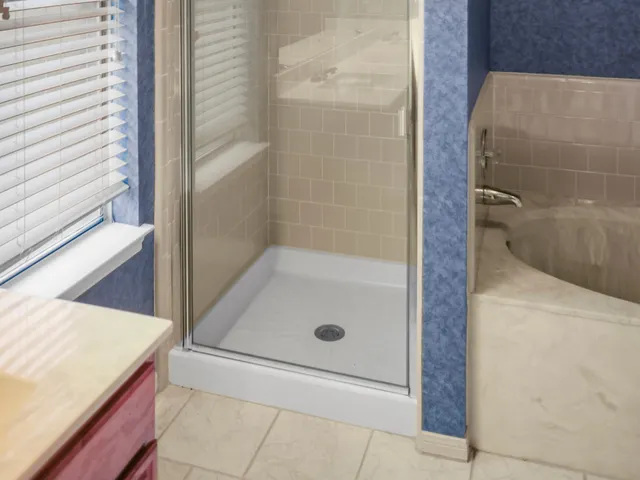 a backyard of a house with barbeque oven table and chairs