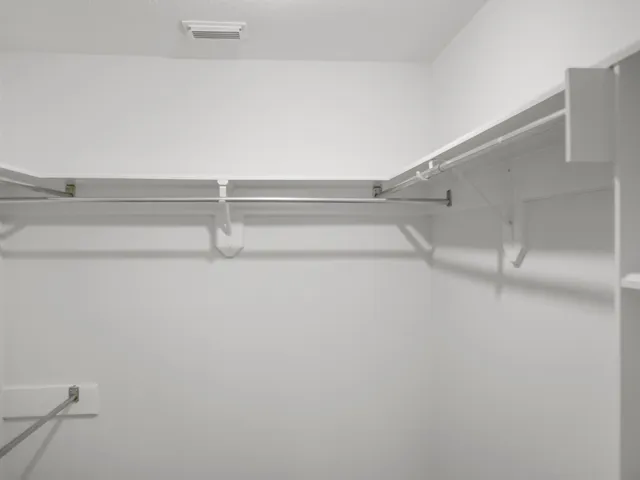 a kitchen with granite countertop a sink and cabinets