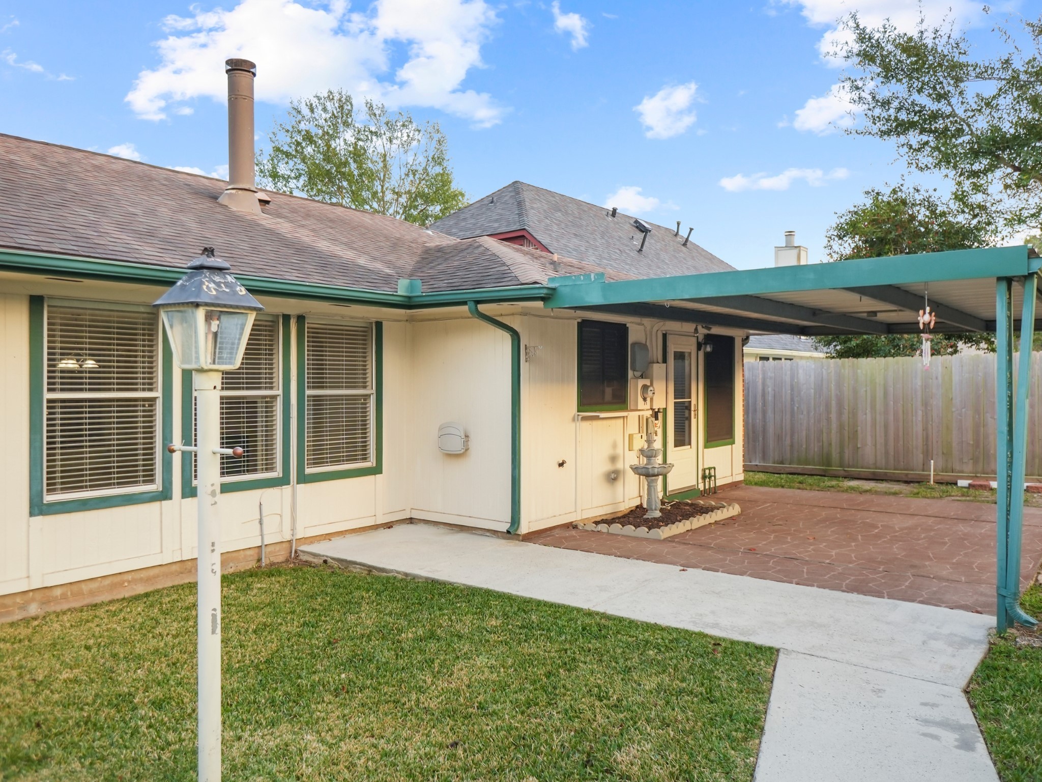 19623 Westbridge Lane Spring, TX 77379 - Photo 37 of 48 a backyard of a house with barbeque oven table and chairs
