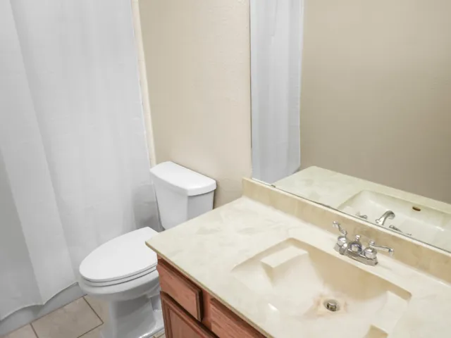 a view of a chandelier fan in a room