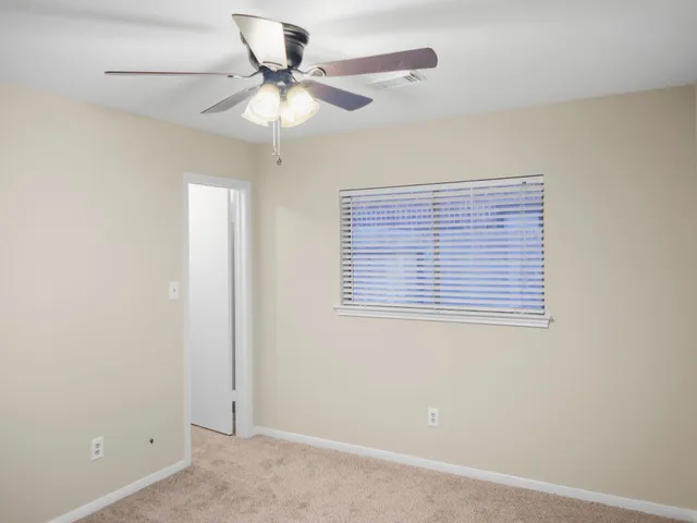 a view of a hallway with a chandelier