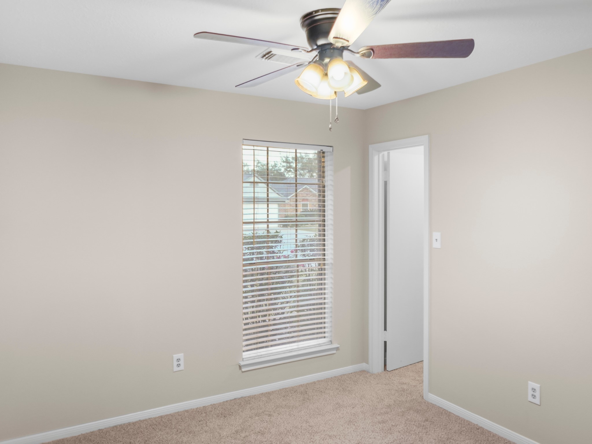 19623 Westbridge Lane Spring, TX 77379 - Photo 47 of 48 an empty room with windows and fan