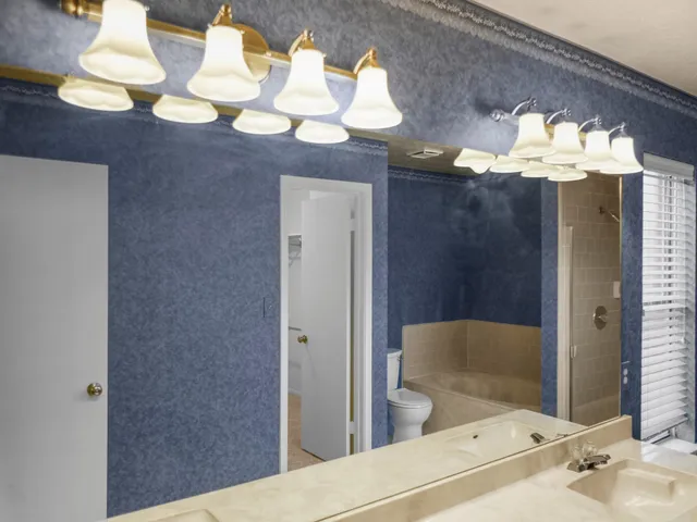 a kitchen with a stove and a refrigerator