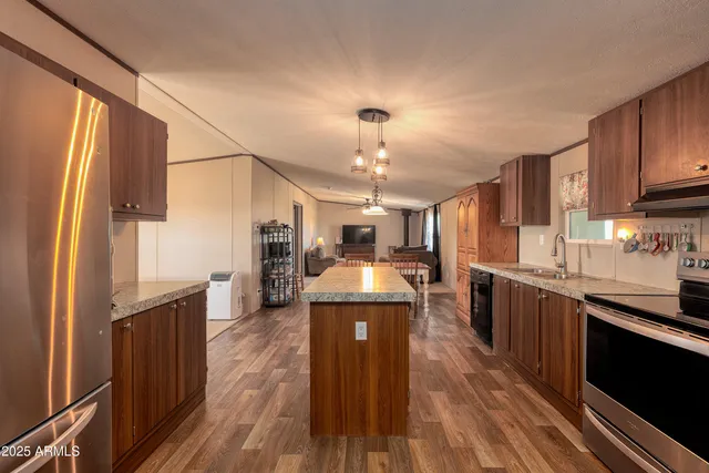 a kitchen with a stove and a sink