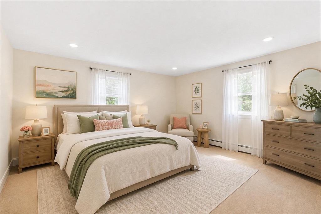 420 Great Road, Unit C1 Acton, MA 01720 - Photo 10 of 29 a bedroom with a bed and wooden floor