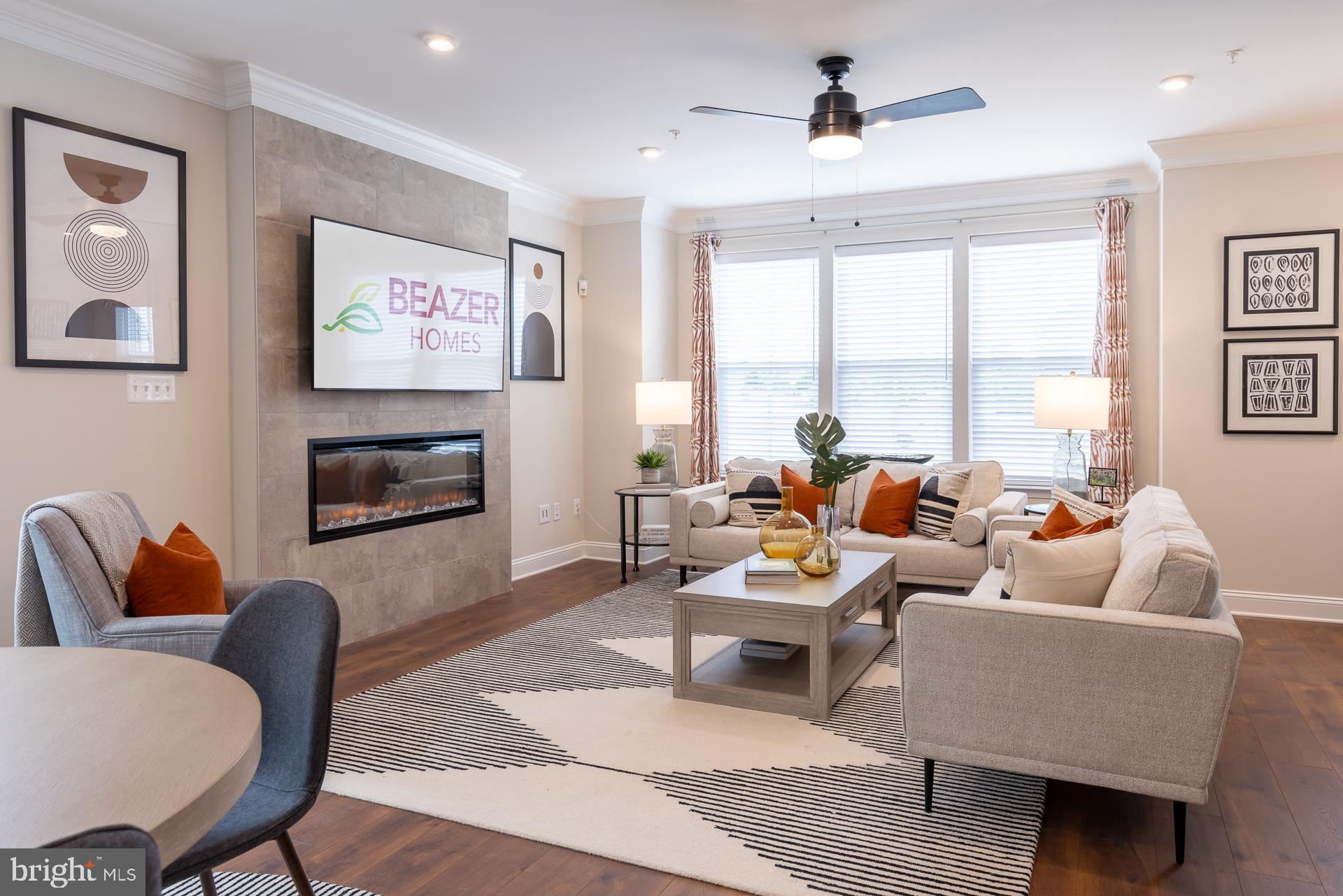 8272 Longford Road Glen Burnie, MD 21061 - Photo 4 of 11 a living room with furniture ceiling fan and a rug