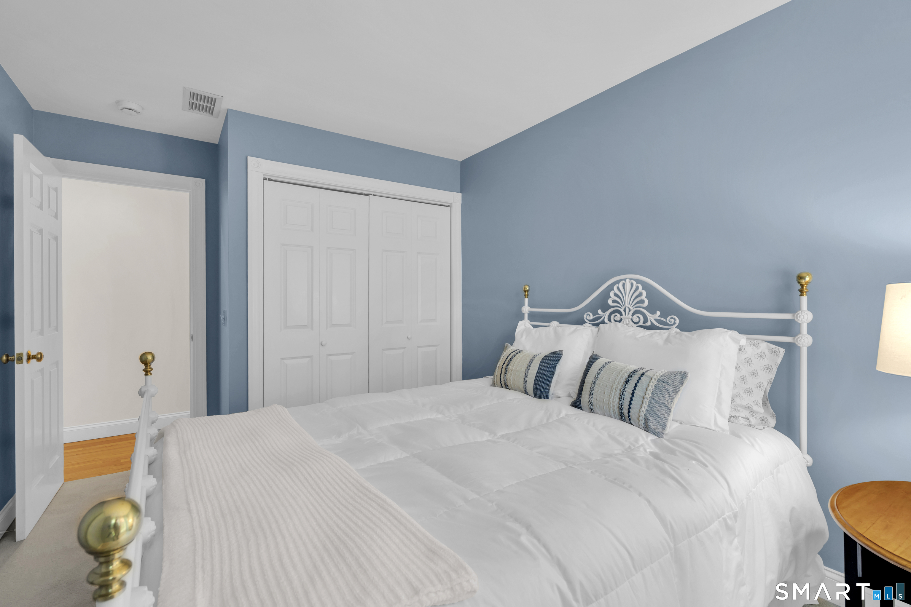 21 Stone Wall Road Salem, CT 06420 - Photo 22 of 38 a bedroom with a bed and lamps